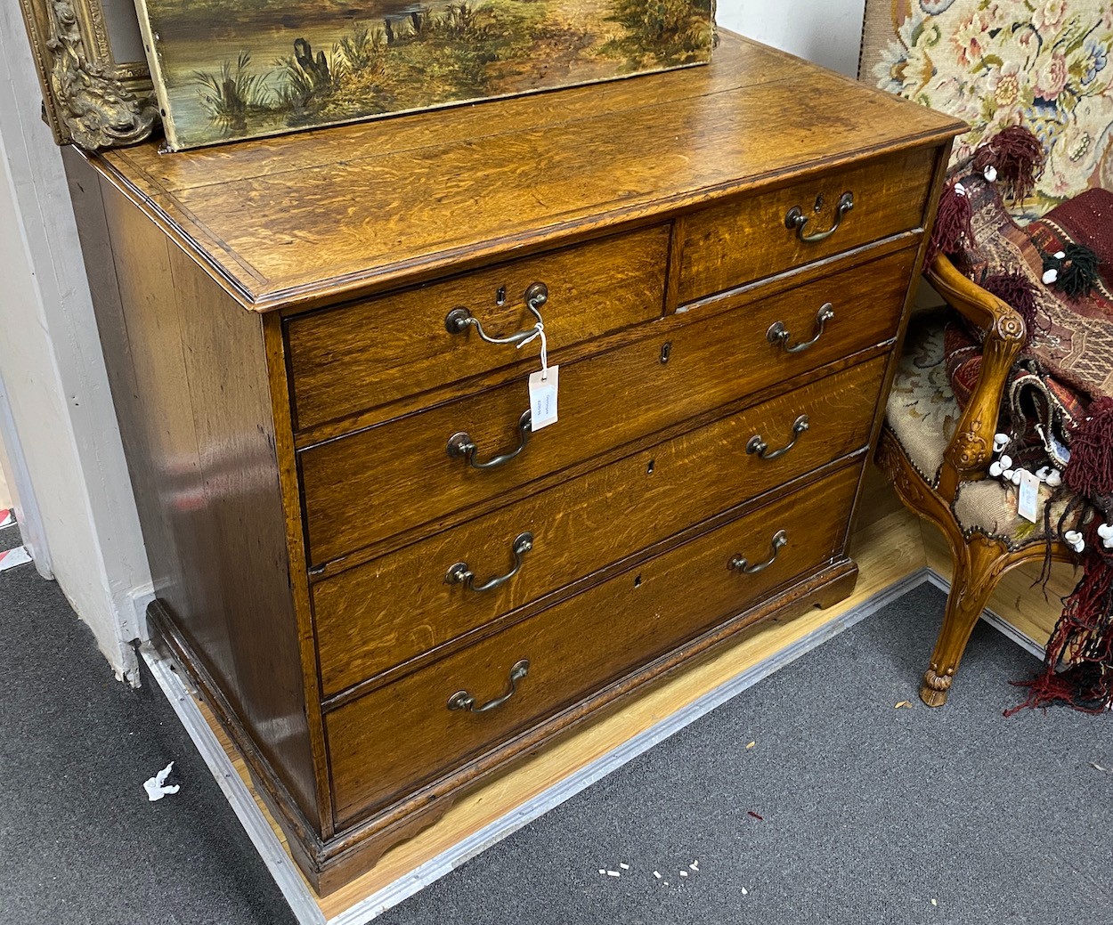 A George III banded oak chest of two short and three long drawers, width 99cm, depth 56cm, height 84cm